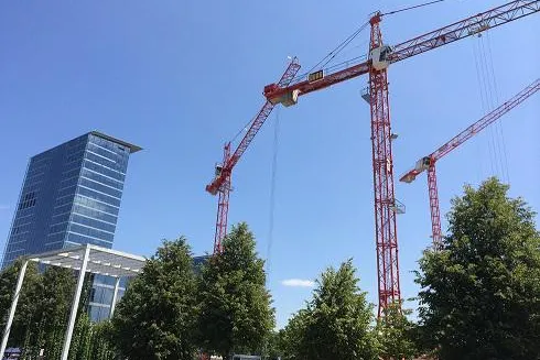 Bild: Ein starkes Team – zwei WOLFF-Generationen errichten Münchener twin yards