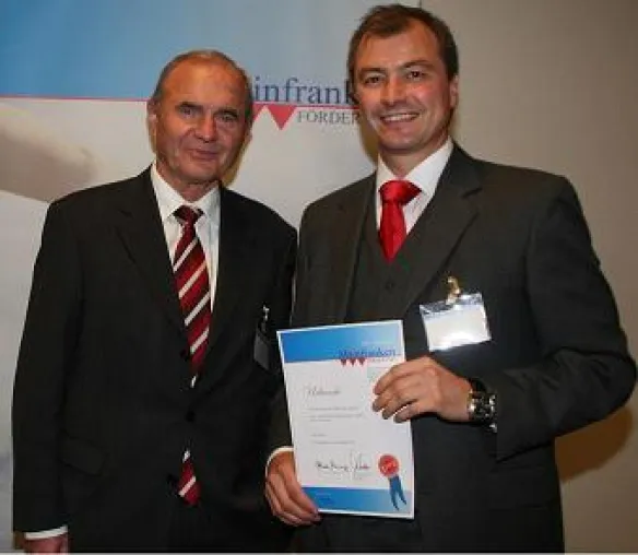 Bild: Prof. Dr. Otmar Issing zeichnet Rolf Popp Pro Consult (RPPC) aus