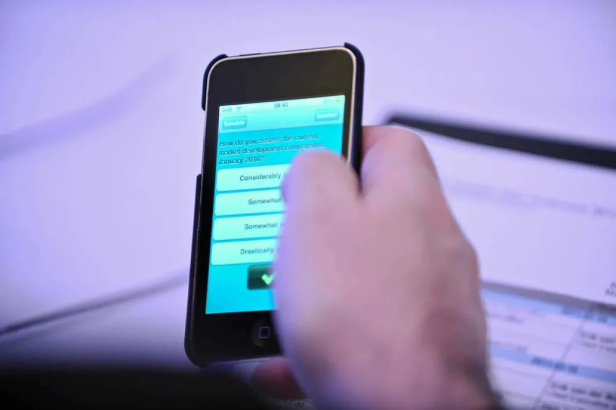 Tagungsteilnehmer liefern Kommentare mittels iPod oder iPad