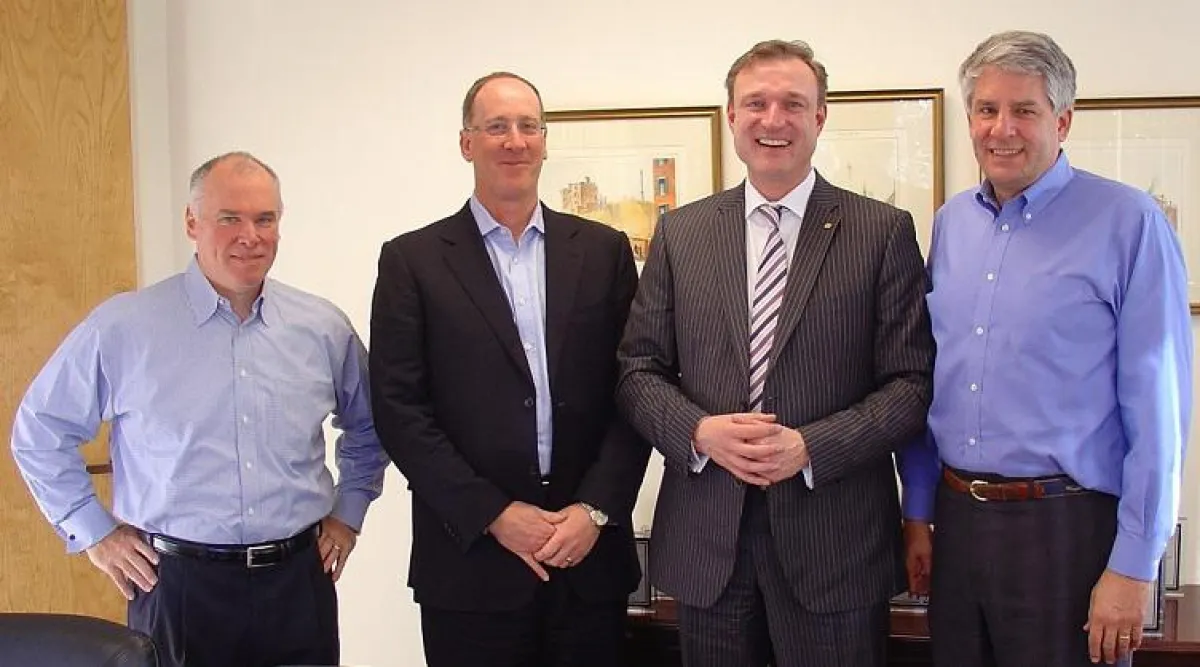 axanta AG startet Kooperation mit US-M&A-Berater Consilium Partners