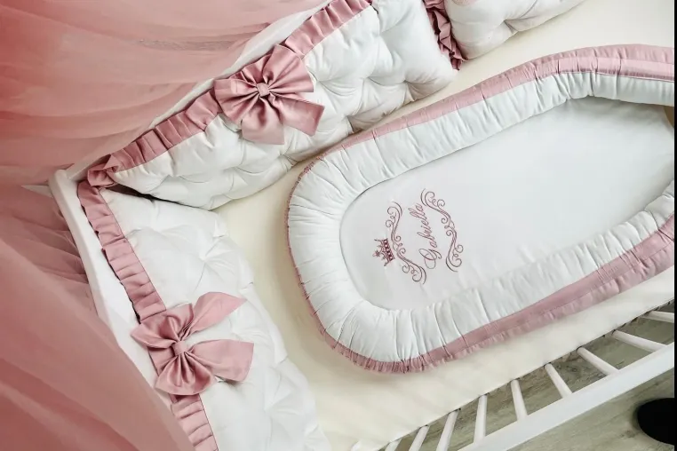 Bild: Handmade Babynest mit Namen