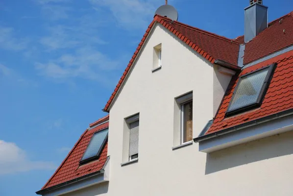 Bild: Wärmedämmung und Klimaschutz - Zufriedene Bauherren berichten über Einsparungen