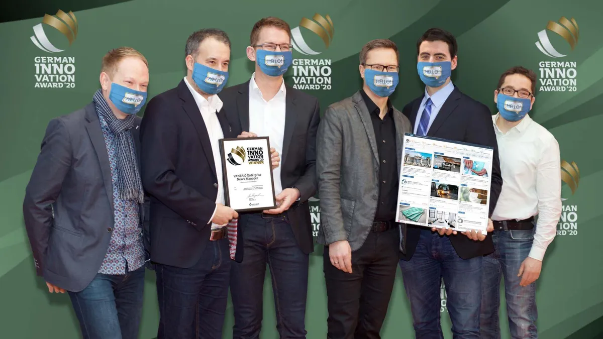 VANTAiO Gewinner-Team vor der Digital-Photo-Wall
