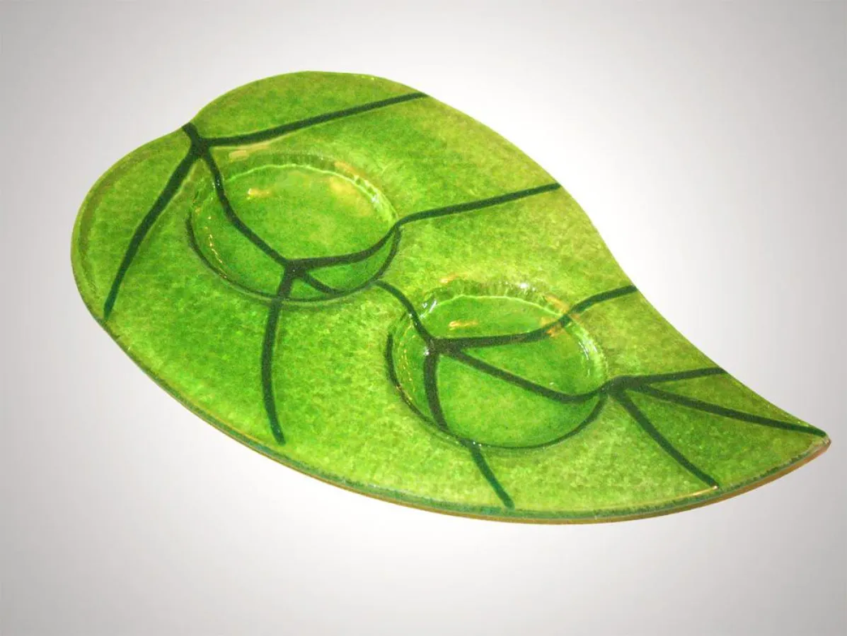 Blattförmiger Kerzenständer, Farbe: grün, erhältlich bei AMAC Shop für 10,90 EUR (inkl. MwSt.)