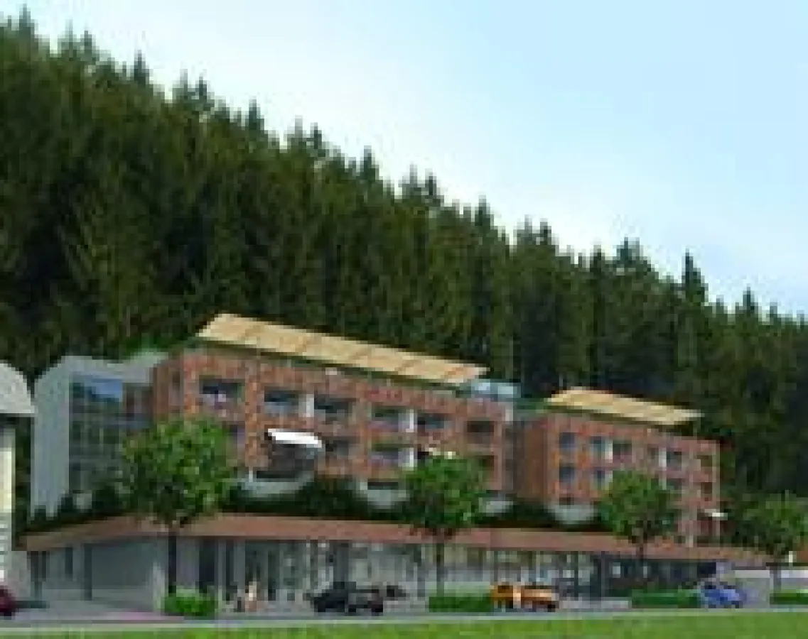 Holzschindeln und viel Glas dominieren die Fassade des Neubaus.