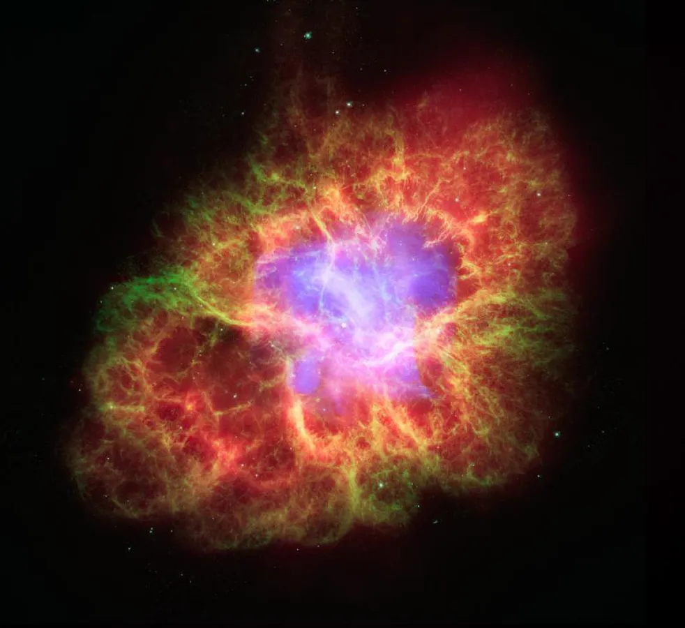 Der Krebsnebel (M1) - Komposit aus Aufnahmen bei verschiedenen Wellenlängen: Infrarot (rot, Spitzer) sichtbares Licht (grün, Hubble), Röntgen (hellblau, Chandra). (Bildquelle: NASA)