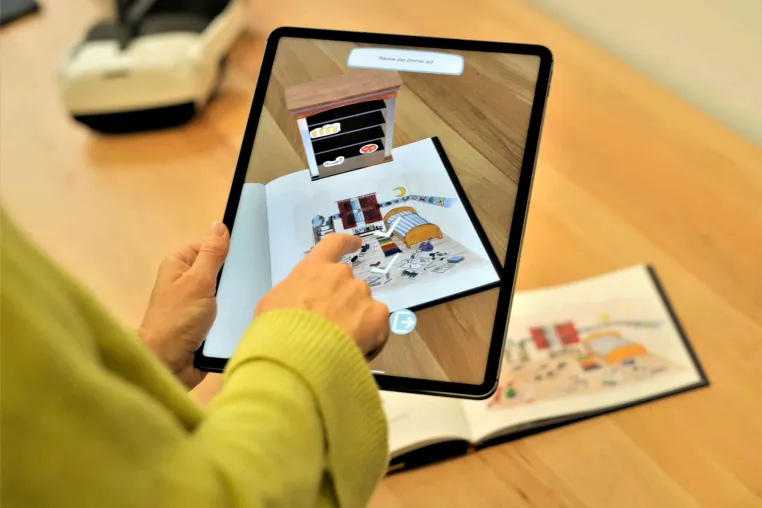 Wenn zwei Welten ineinanderfließen – das analoge Buch und die erweiterte digitale Welt Bild: Wenn zwei Welten ineinanderfließen – das analoge Buch und die erweiterte digitale Welt