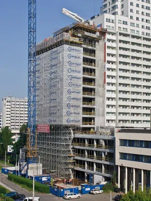 Filigranes Netz aus Stahlbeton prägt und trägt Bürohochhaus Bild: Filigranes Netz aus Stahlbeton prägt und trägt Bürohochhaus