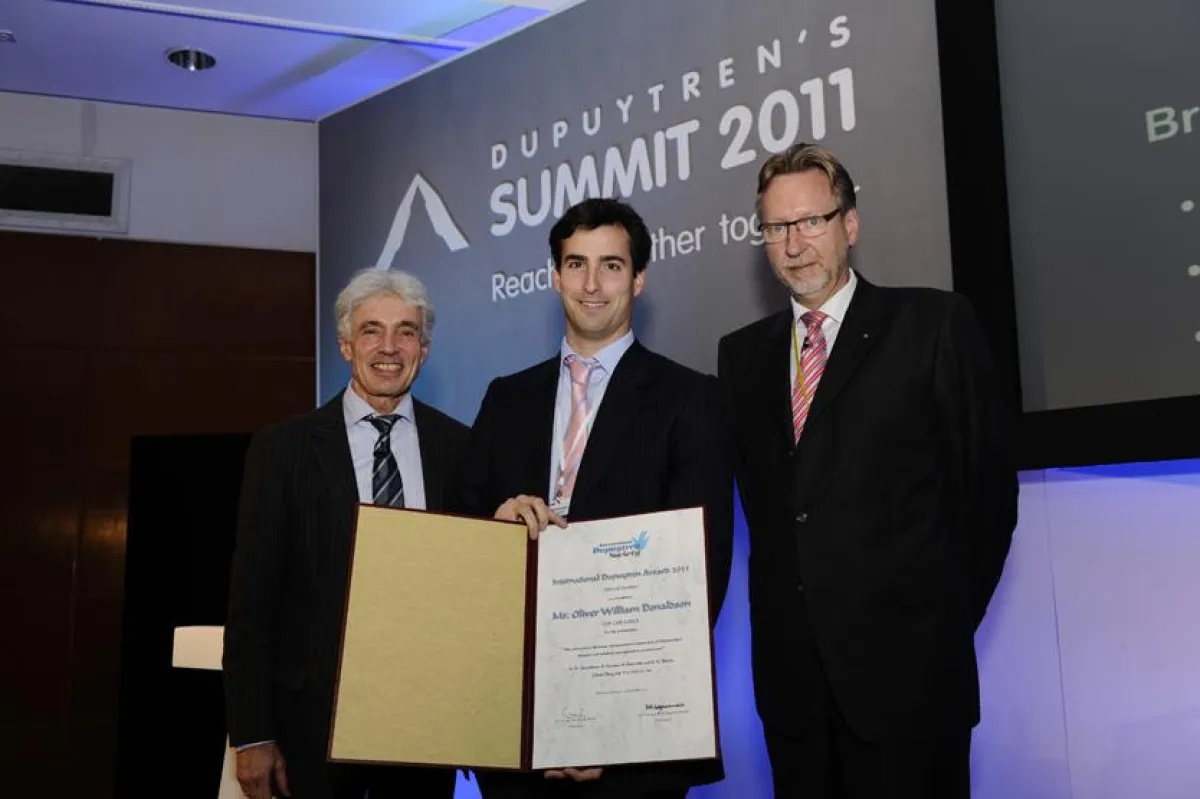Prof. Heinrich Seegenschmiedt, Preisträger Oliver Donaldson, PD Dr. Bert Reichert (rechts)