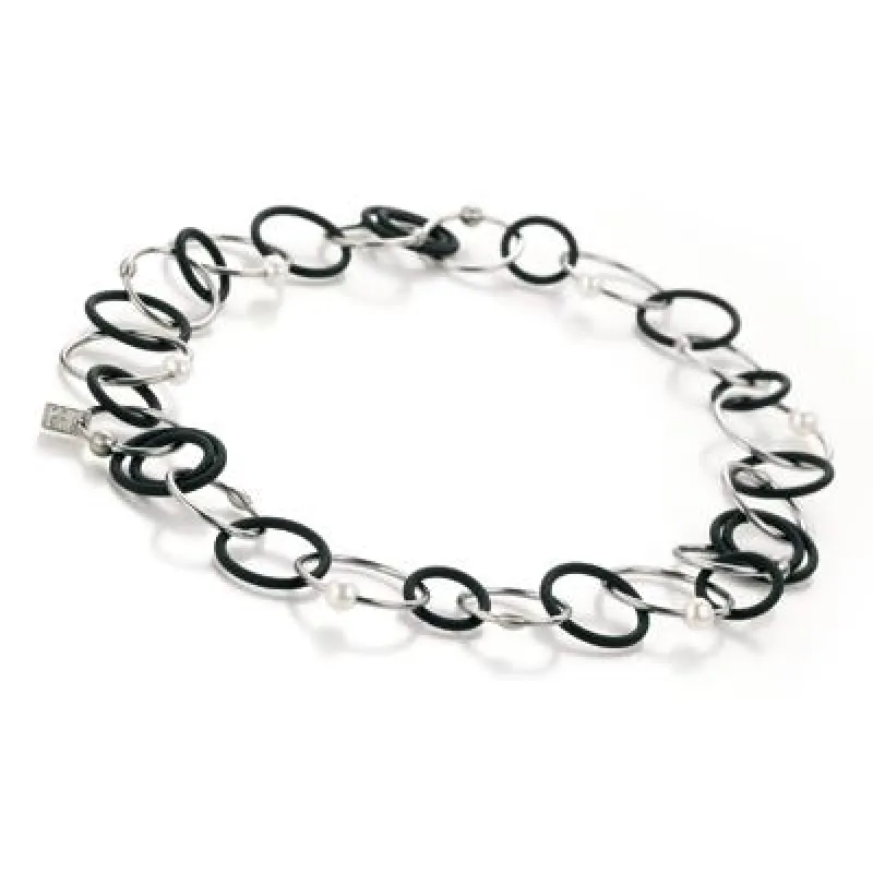 Collier TeNo endless mit weißen Perlen, fein satiniertem Edelstahl und samtschwarzem Kautschuk