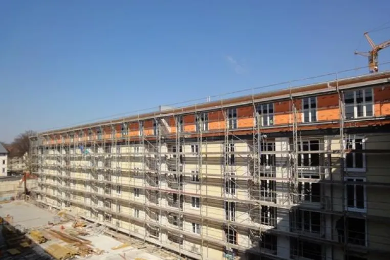 Bild: Gebäudeaufstockung in Holzbauweise schaffen zusätzlich 2.800 m² Wohnraum