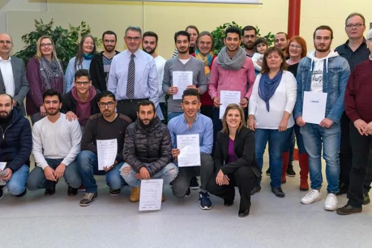Bild: Stolz auf die erfolgreichen Flüchtlinge
